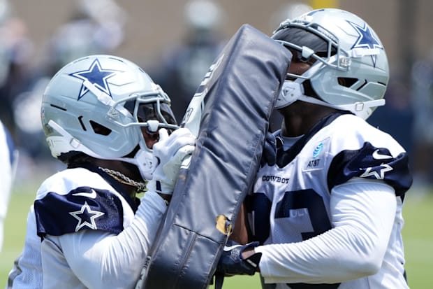 Dallas Cowboys running backs Miles Sanders and Javonte Williams participate in blocking drills during training camp 