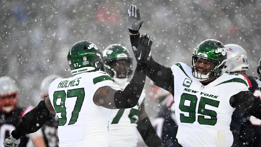 Jan 7, 2024; Foxborough, Massachusetts, USA; New York Jets defensive end Jalyn Holmes (97) celebrates with defensive tackle Quinnen Williams (95) after a sack against the New England Patriots during the second half at Gillette Stadium. 
