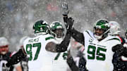 Jan 7, 2024; Foxborough, Massachusetts, USA; New York Jets defensive end Jalyn Holmes (97) celebrates with defensive tackle Quinnen Williams (95) after a sack against the New England Patriots during the second half at Gillette Stadium. 