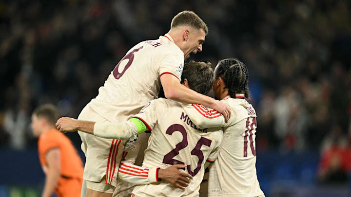 Bayern Munich players celebrating Thomas Muller's goal against Shakhtar Donetsk.