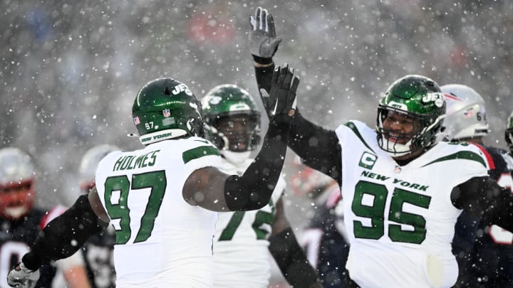 Jan 7, 2024; Foxborough, Massachusetts, USA; New York Jets defensive end Jalyn Holmes (97) celebrates with defensive tackle Quinnen Williams (95) after a sack against the New England Patriots during the second half at Gillette Stadium. 