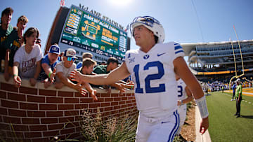 Jake Retzlaff high fives fans at McLane Stadium after posting a win over Baylor.