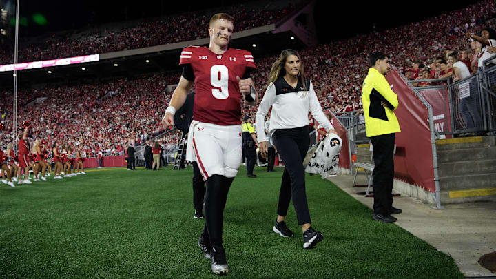 Aug 28, 2025; Madison, Wisconsin, USA;  Wisconsin Badgers quarterback Billy Edwards Jr. (9) walks to the locker room after being injured during the second quarter against the Miami (OH) RedHawks at Camp Randall Stadium. Mandatory Credit: Jeff Hanisch-Imagn Images