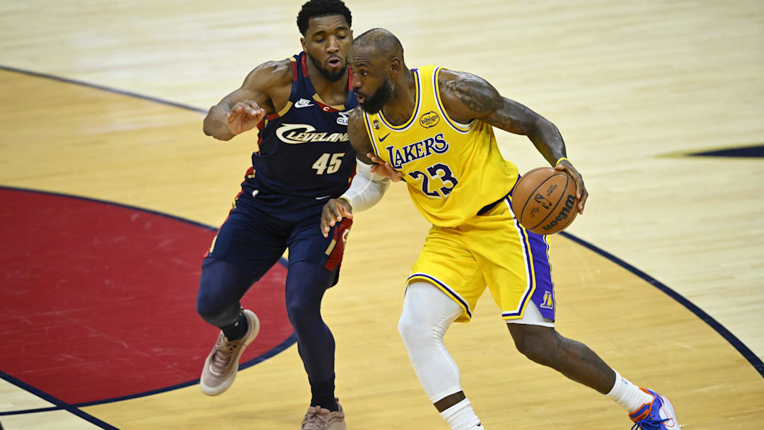 Jan 28, 2026; Cleveland, Ohio, USA; Cleveland Cavaliers guard Donovan Mitchell (45) defends Los Angeles Lakers forward LeBron James (23) in the fourth quarter at Rocket Arena. Mandatory Credit: David Richard-Imagn Images Jan 28, 2026; Cleveland, Ohio, USA; Cleveland Cavaliers guard Donovan Mitchell (45) defends Los Angeles Lakers forward LeBron James (23) in the fourth quarter at Rocket Arena. Mandatory Credit: David Richard-Imagn Images