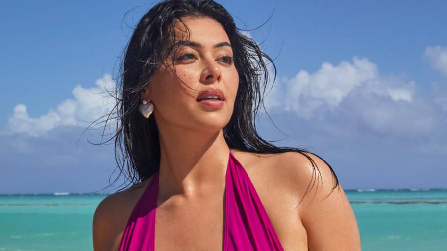 Lauren Chan was photographed by James Macari in the Dominican Republic. Swimsuit by Initial S Paris. Earrings by omè.