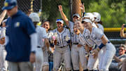 Notre Dame Sherman Oaks softball celebrates after a homerun.