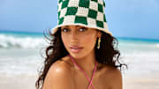 Cindy Kimberly was photographed by Ben Watts in Barbados. Swimsuit by SKATIE. Hat by Memorial Day.