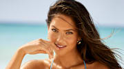 Christen Harper was photographed by Ben Watts in Barbados. Swimsuit by Daze Dayz. Earrings by Mejuri.
