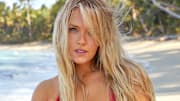 Camille Kostek was photographed by James Macari in the Dominican Republic. Swimsuit by Swim by Di.