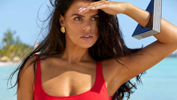 Brooks Nader was photographed by James Macari in the Dominican Republic. Swimsuit by Matthew Bruch. Bracelets by Noir provided by New York Vintage. Earrings by Electric Picks x Brooks Nader.