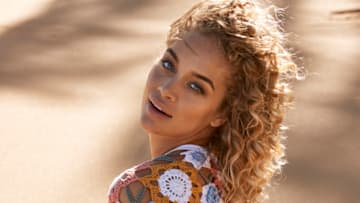 Jasmine Sanders was photographed by Ben Watts in Puerto Rico. Swimsuit by Lauren Layne Swim. Top by Andi Bagus.