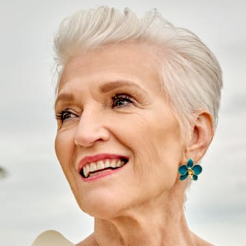 Maye Musk was photographed by Yu Tsai in Belize. Earrings by Cleopatra's Bling. 