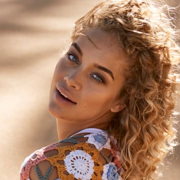 Jasmine Sanders was photographed by Ben Watts in Puerto Rico. Swimsuit by Lauren Layne Swim. Top by Andi Bagus.