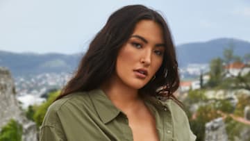 Yumi Nu was photographed by James Macari in Montenegro. Swimsuit by Monday Swimwear. Top by H&M. Earrings by Michelle Ross.