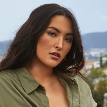 Yumi Nu was photographed by James Macari in Montenegro. Swimsuit by Monday Swimwear. Top by H&M. Earrings by Michelle Ross.