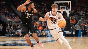 Illinois guard Kasparas Jakucionis (32) drives to the basket against Xavier forward Jerome Hunter (2) in an NCAA Tournament game at Fiserv Forum in Milwaukee, Wisconsin on Friday, March 21, 2025.