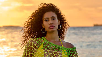 Leyna Bloom was photographed by Yu Tsai in Belize. Swimsuit by Navy Ray. Dress by Celia B. Earrings by 8 Other Reasons.