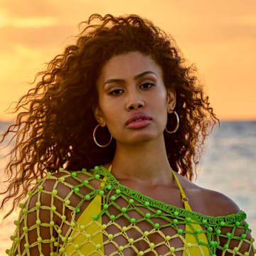 Leyna Bloom was photographed by Yu Tsai in Belize. Swimsuit by Navy Ray. Dress by Celia B. Earrings by 8 Other Reasons.