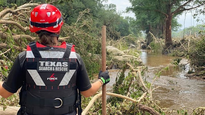 TEXSAR search-and-rescue volunteers scour the banks of the Guadalupe River, looking for victims of the recent floods. The group has deployed 50 volunteers and six swift-water rescue boats to help search for victims. Mandatory Credit: Courtesy of TEXSAR via Imagn Images