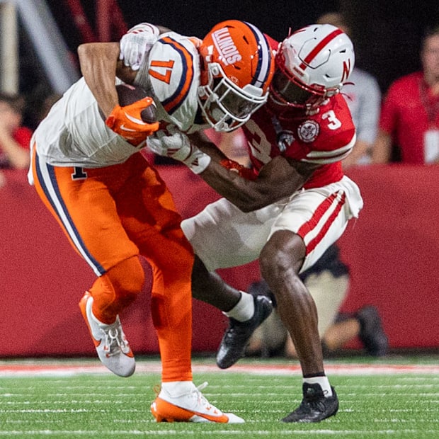 Nebraska defensive back Marques Buford Jr. brings down Illinois wide receiver Collin Dixon.
