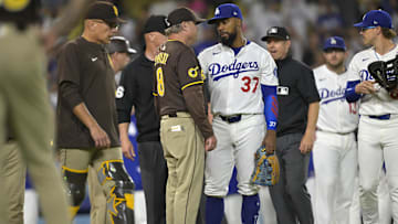 Jun 19, 2025; San Diego Padres manager Mike Shildt (8) talks with Los Angeles Dodgers right fielder Teoscar Hernandez (37) as play is about to resume after benches cleared in the eighth inning at Dodger Stadium. Mandatory Credit: Jayne Kamin-Oncea-Imagn Images