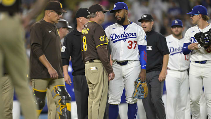 Jun 19, 2025; San Diego Padres manager Mike Shildt (8) talks with Los Angeles Dodgers right fielder Teoscar Hernandez (37) as play is about to resume after benches cleared in the eighth inning at Dodger Stadium. Mandatory Credit: Jayne Kamin-Oncea-Imagn Images