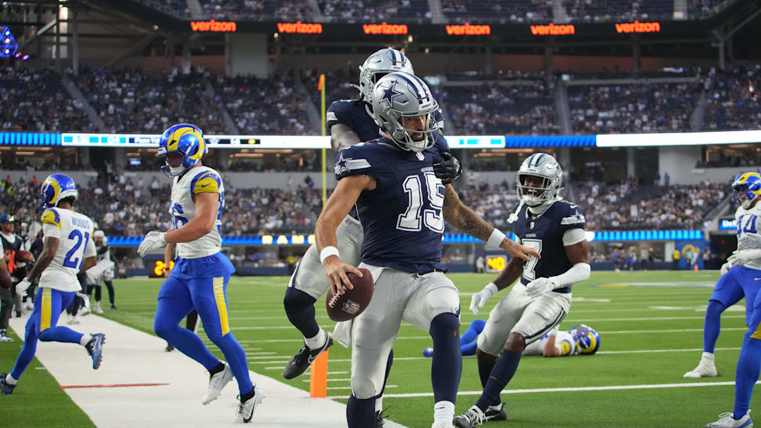 Aug 9, 2025; Inglewood, California, USA; Dallas Cowboys quarterback Will Grier (15) celebrates with tight end Rivaldo Fairweather (45) and wide receiver Traeshon Holden (7) after scoring on a 8-yard touchdown run against the Los Angeles Rams in the fourth quarter at SoFi Stadium. Mandatory Credit: Kirby Lee-Imagn Images