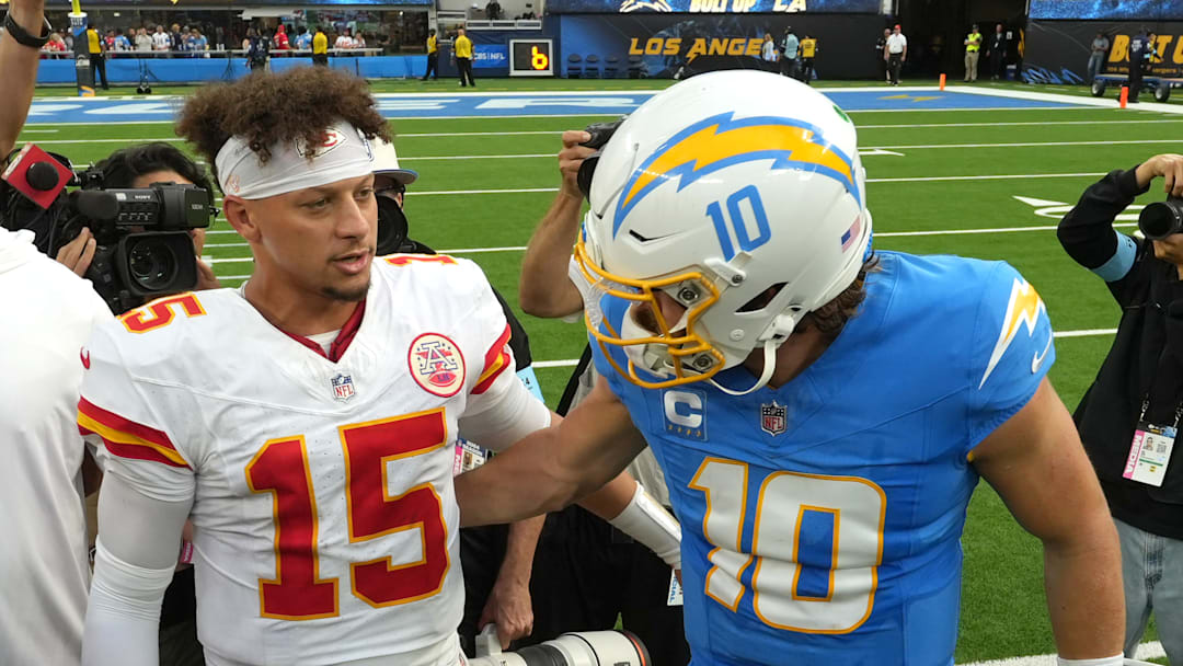 Sep 29, 2024; Inglewood, California, USA; Kansas City Chiefs quarterback Patrick Mahomes (15) and Los Angeles Chargers quarterback Justin Herbert (10) shake hands after the game at SoFi Stadium. Mandatory Credit: Kirby Lee-Imagn Images