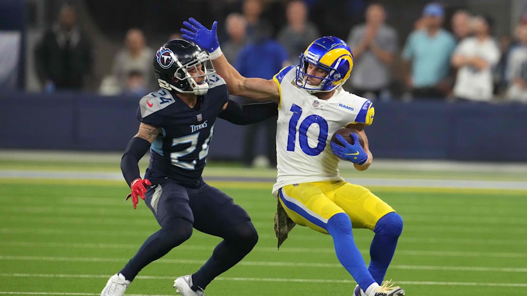 Nov 7, 2021; Inglewood, California, USA; Los Angeles Rams wide receiver Cooper Kupp (10) is defended by Tennessee Titans cornerback Elijah Molden (24) in the second half at SoFi Stadium. Mandatory Credit: Kirby Lee-Imagn Images