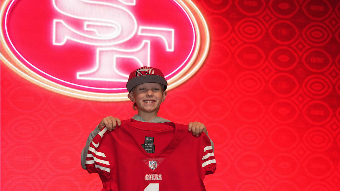 A fan poses with San Francisco 49ers jersey at the NFL Draft