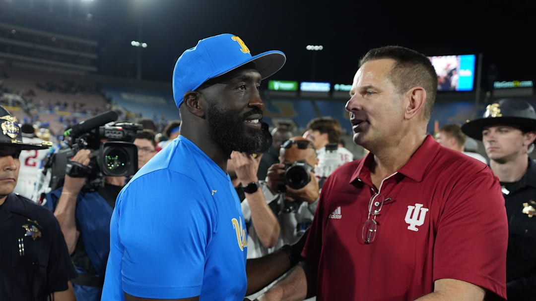 Sep 14, 2024; Pasadena, California, USA; UCLA Bruins head coach DeShaun Foster (left) and Indiana Hoosiers head coach Curt Cignetti shake hands after the game at Rose Bowl. Mandatory Credit: Kirby Lee-Imagn Images