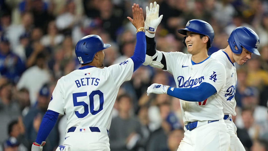 Jun 11, 2024; Los Angeles, California, USA; Los Angeles Dodgers designated hitter Shohei Ohtani (17) celebrates at home plate with shortstop Mookie Betts (50) after hitting a two-run home run in the sixth inning against the Texas Rangers at Dodger Stadium. at Dodger Stadium. Mandatory Credit: Kirby Lee-Imagn Images