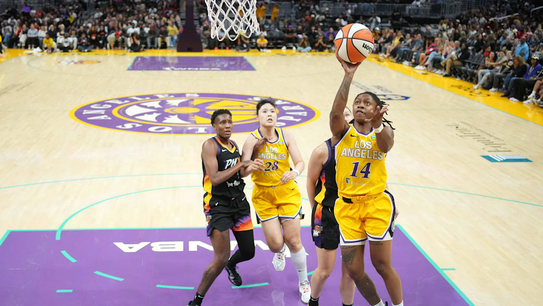 Sep 17, 2024; Los Angeles, California, USA; LA Sparks guard Crystal Dangerfield (14) shoots the ball against the Phoenix Mercury in the second half at Crypto.com Arena. Mandatory Credit: Kirby Lee-Imagn Images