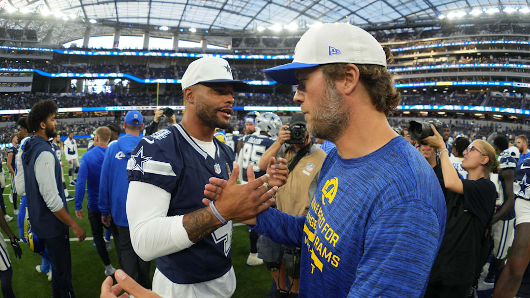 Aug 9, 2025; Inglewood, California, USA; Dallas Cowboys quarterback Dak Prescott (4) shakes hands with Los Angeles Rams quarterback Matthew Stafford after the game at SoFi Stadium. Mandatory Credit: Kirby Lee-Imagn Images