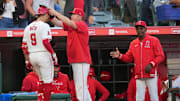 Angels shortstop Zach Neto (9) is congratulated by bench coach Ray Montgomery (81) and manager Ron Washington after hitting a two-run home run in the fourth inning against the Milwaukee Brewers at Angel Stadium on June 17, 2024