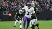 Minnesota Vikings wide receiver Jordan Addison (3) carries the ball against Las Vegas Raiders cornerback Jack Jones (18) in the second half at Allegiant Stadium in Paradise, Nev., on Dec. 10, 2023.