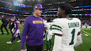 Oct 6, 2024; London, United Kingdom; Minnesota Vikings coach Kevin O'Connell (left) talks with New York Jets cornerback Sauce Gardner (1) after the game at Tottenham Hotspur Stadium. Mandatory Credit: Kirby Lee-Imagn Images
