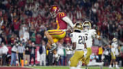 Nov 26, 2022; Los Angeles, California, USA; Southern California Trojans quarterback Caleb Williams (13) celebrates after rushing for a touchdown against the Notre Dame Fighting Irish in the second half at United Airlines Field at Los Angeles Memorial Coliseum. Mandatory Credit: Kirby Lee-USA TODAY Sports