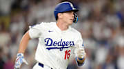 Jun 18, 2025; Los Angeles, California, USA; Los Angeles Dodgers catcher Will Smith (16) runs the bases after hitting a walkoff home run against the San Diego Padres at Dodger Stadium. Mandatory Credit: Kirby Lee-Imagn Images