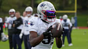 Oct 18, 2024; London, United Kingdom; New England Patriots wide receiver Kayshon Boutte (9) catches the ball during practice at the Harrow School. Mandatory Credit: Kirby Lee-Imagn Images