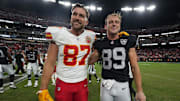 Oct 27, 2024; Paradise, Nevada, USA; Kansas City Chiefs tight end Travis Kelce (87) and Las Vegas Raiders tight end Brock Bowers (89) pose after the game at Allegiant Stadium. Mandatory Credit: Kirby Lee-Imagn Images