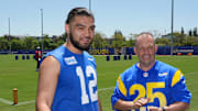 May 7, 2025; Woodland Hills, CA, USA; Los Angeles Rams receiver Puka Nacua (left) talks with Hawaii governor Josh Green, M.D. after a press conference at the Rams Practice Facility to announce a partnership between the Rams and the Hawaii Tourism Authority to hold minicamp in Maui. Mandatory Credit: Kirby Lee-Imagn Images