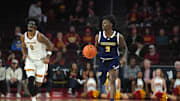 Nov 4, 2024; Los Angeles, California, USA; Chattanooga Mocs guard Trey Bonham (2) dribbles the ball against Southern California Trojans forward Saint Thomas (0) in the second half at Galen Center. Mandatory Credit: Kirby Lee-Imagn Images