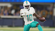 Nov 11, 2024; Inglewood, California, USA; Miami Dolphins wide receiver Tyreek Hill (10) carries the ball against the Los Angeles Rams in the first half at SoFi Stadium. Mandatory Credit: Kirby Lee-Imagn Images