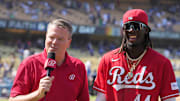 Jul 30, 2023; Los Angeles, California, USA; Bally Sports reporter Jim Day (left) interviews Cincinnati Reds shortstop Elly De La Cruz (44) after the game against the Los Angeles Dodgers at Dodger Stadium. Mandatory Credit: Kirby Lee-Imagn Images