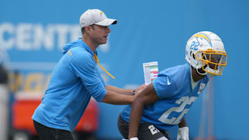 Jun 14, 2022; Costa Mesa, California, USA; Los Angeles Chargers coach Brandon Staley (left) and