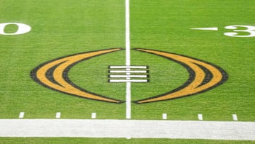The College Football Playoff logo on the field at State Farm Stadium, the site of the 2022 CFP Semifinal between the TCU Horned Frogs and the Michigan Wolverines.