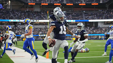 Aug 9, 2025; Inglewood, California, USA; Dallas Cowboys quarterback Will Grier (15) celebrates with tight end Rivaldo Fairweather (45) and wide receiver Traeshon Holden (7) after scoring on a 8-yard touchdown run against the Los Angeles Rams in the fourth quarter at SoFi Stadium. Mandatory Credit: Kirby Lee-Imagn Images