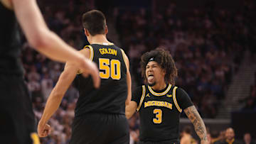 Jan 7, 2025; Los Angeles, California, USA; Michigan Wolverines center Vladislav Goldin (50) celebrates with guard Tre Donaldson (3) against the UCLA Bruins in the first half at Pauley Pavilion presented by Wescom. Mandatory Credit: Kirby Lee-Imagn Images