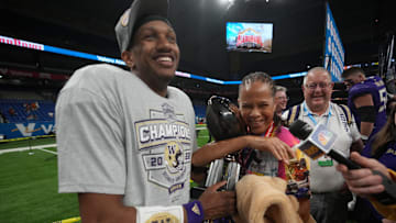 Dec 29, 2022; San Antonio, Texas, USA; Washington Huskies quarterback Michael Penix Jr. (9) holds the most valuable offensive player trophy after the 2022 Alamo Bowl against the Texas Longhorns at Alamodome. Mandatory Credit: Kirby Lee-Imagn Images